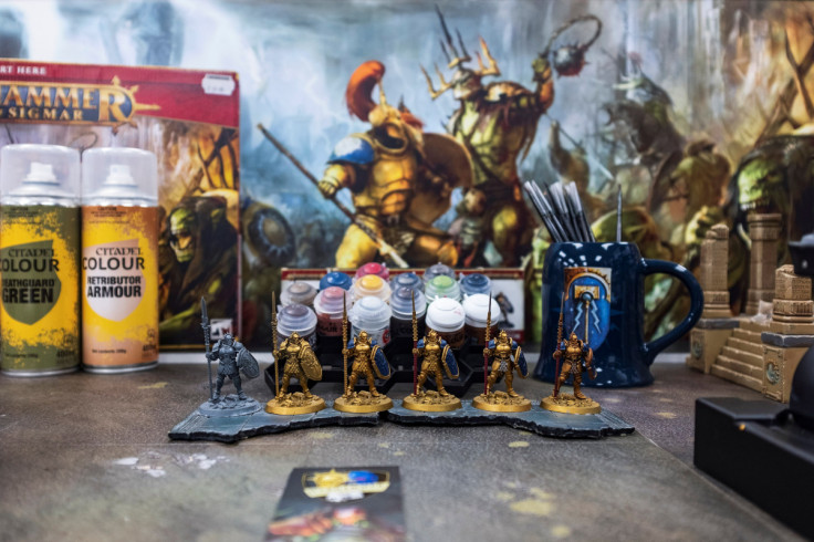 Figures sit on display at a Warhammer store, a brand owned by Games Workshop, in London