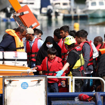 Migrants arrive at Dover harbour after being rescued while attempting to cross the English Channel
