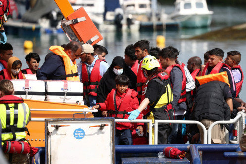 Migrants arrive at Dover harbour after being rescued while attempting to cross the English Channel