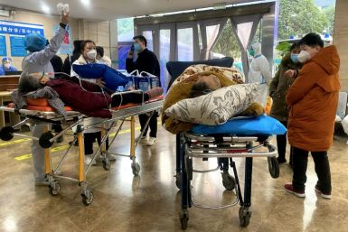 Covid-19 patients lay on stretchers in the emergency ward of the First Affiliated Hospital of Chongqing Medical University in southwestern China