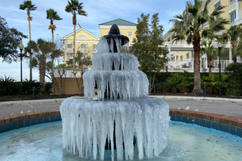 Ice adorns a fountain in Charleston, South Carolina, on December 24, 2022, as a deadly winter storm blanketed much of the United States with frigid temperatures, fierce winds and blinding snow