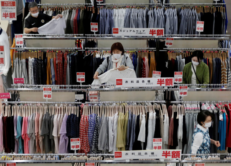 Shoppers wearing protective masks choose clothes at Japan's supermarket group Aeon's shopping mall as the mall reopens amid the coronavirus disease (COVID-19) outbreak in Chiba