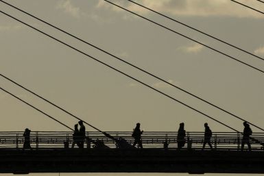 People walk a bridge in Krasnogorsk outside Moscow