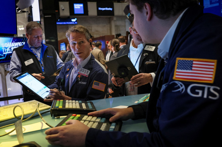 Traders work on the floor of the NYSE in New York