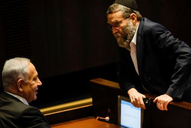 Moshe Gafni, head of United Torah Judaism party, chats with Israeli designate Prime Minister Benjamin Netanyahu during a session at the plenum at the Knesset, Israel's parliament in Jerusalem