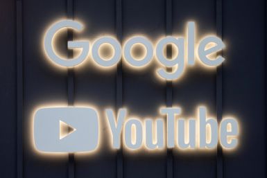The logos of Google and YouTube are seen in Davos