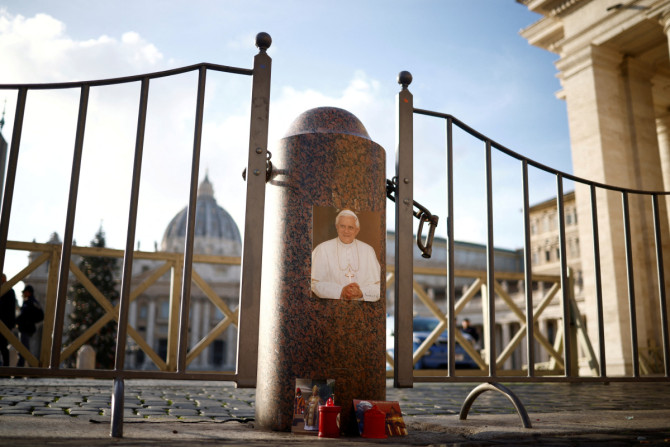 Candles stand next to St. Peter's Square after former Pope Benedict died in the Vatican