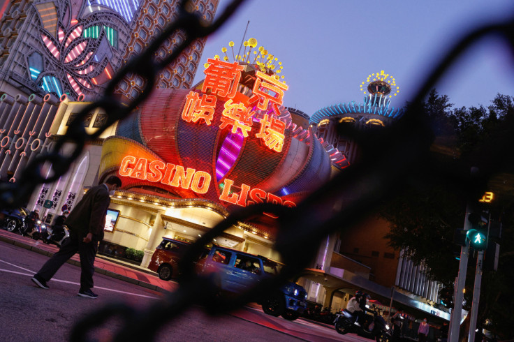 A man wearing face mask walks in front of Casino Lisboa, operated by SJM Holdings during the coronavirus disease (COVID-19) pandemic in Macau