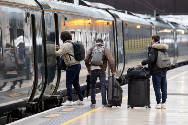 Passengers board a GWR train at Paddington Station  in London