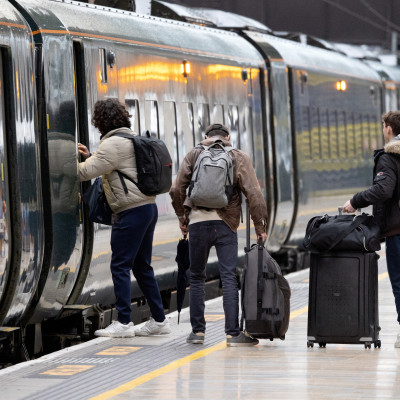 Passengers board a GWR train at Paddington Station  in London