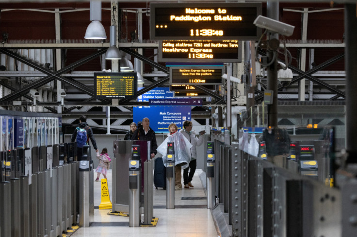 Passengers arrive at Paddington Station  in London