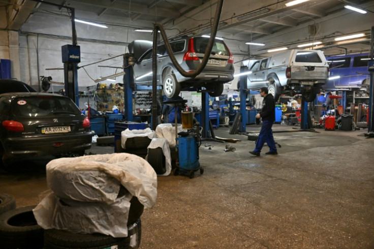 Ukrainian mechanics repair and modify used pickup trucks for use on the frontline of the war with Russia