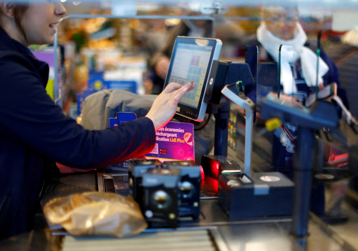 Customers shop in a Lidl supermarket near Nice