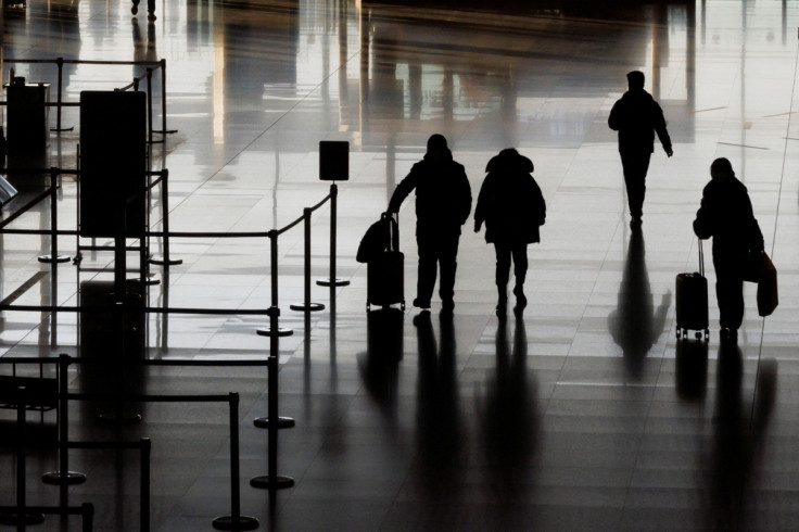 People walk in the departures hall at Beijing Capital International Airport after China lifted the COVID-19 quarantine requirement for inbound travellers in Beijing