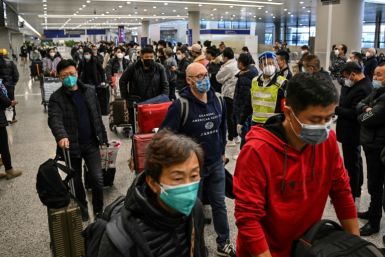 Passengers at international arrivals of Shanghai Pudong International Airport. China has pressed on with its reopening even as infections surge