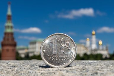 A Russian one rouble coin is pictured in front of the Kremlin in Moscow
