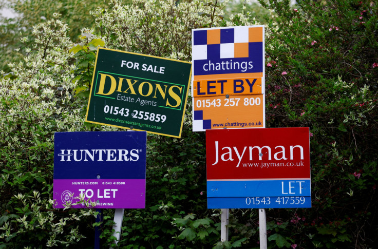 Property estate agent sales and letting signs are seen outside a building