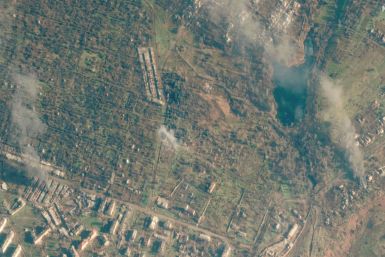 A satellite view shows a smoldering building, in Soledar