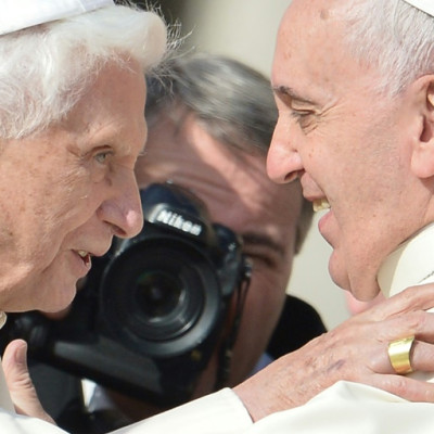 Pope Emeritus Benedict XVI (l) is with Pope Francis in 2014