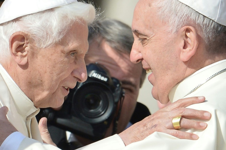 Pope Emeritus Benedict XVI (l) is with Pope Francis in 2014