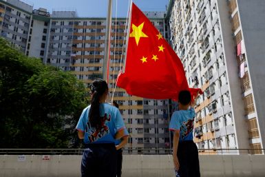 A flag raising team from a primary school perform after the first national flag raising competition in Hong Kong