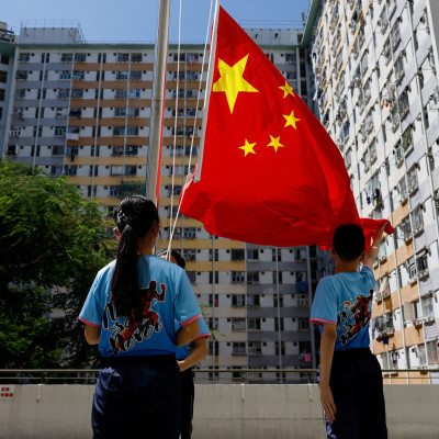 A flag raising team from a primary school perform after the first national flag raising competition in Hong Kong