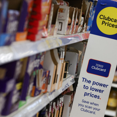 Clubcard branding is seen inside a branch of a Tesco Extra supermarket in London