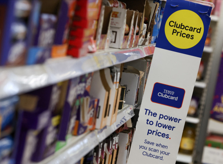 Clubcard branding is seen inside a branch of a Tesco Extra supermarket in London