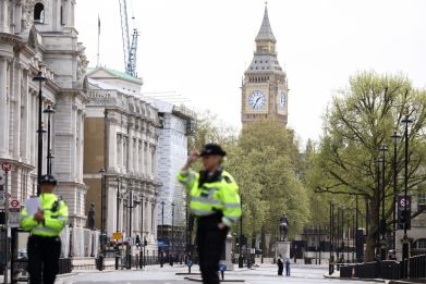 Police close road and arrest man near Downing Street following an incident, in London