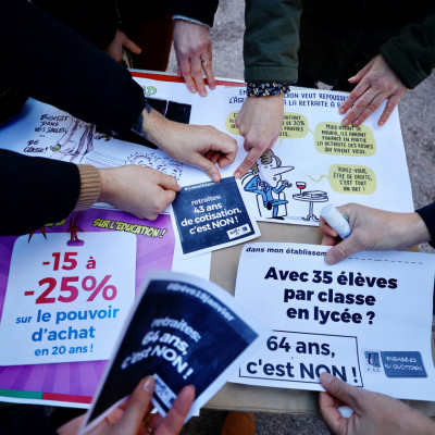 Teachers prepare placards in Cannes ahead of a nationwide strike against pension reform