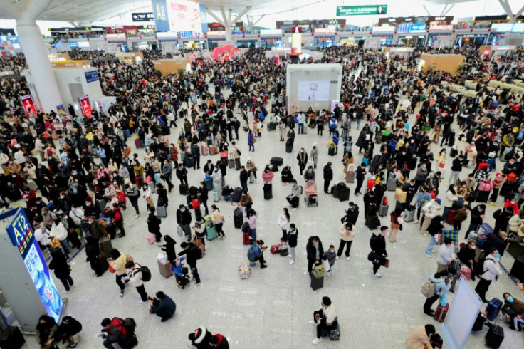 There were huge crowds at train stations in China's big cities as people headed home for the Lunar New Year holidays
