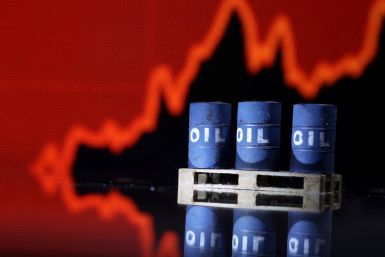 Illustration shows Oil barrels in front of rising stock graph