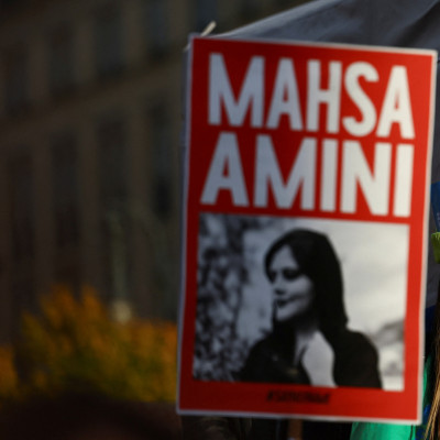 People take part in a protest following the death of Mahsa Amini, in Berlin