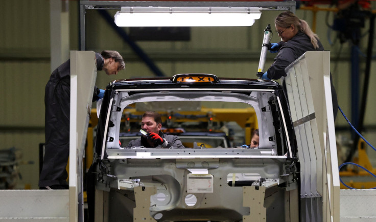 Workers assemble a vehicle on the TX electric taxi production line inside the LEVC (London Electric Vehicle Company) factory in Coventry