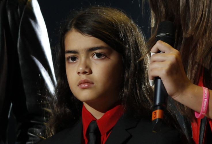 Prince Michael Jackson II (Blanket), one of late singer Michael Jackson's children reacts on stage during the &quot;Michael Forever&quot; tribute concert, which honours late pop icon Michael Jackson, at the Millennium Stadium in Cardiff, Wales