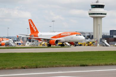 An Easyjet Airbus aircraft taxis close to the northern runway at Gatwick Airport in Crawley