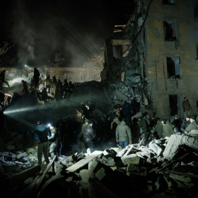 Rescuers search for survivors at an apartment building hit by a rocket in Kramatorsk in the Donetsk region