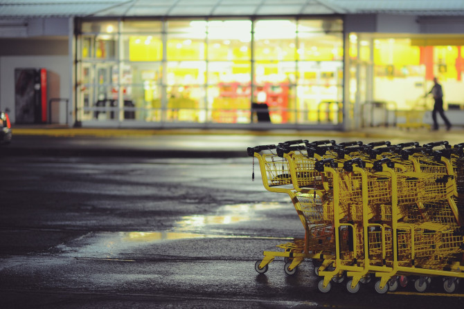 Yellow shopping carts stacked on a parking 