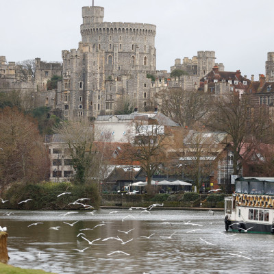 A leisure cruiser is seen on the River Thames near Windsor Castle, in Eton