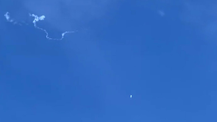 This still image taken from a cellphone video by Haley Walsh in Myrtle Beach, South Carolina, shows an alleged Chinese surveillance balloon after it was shot down on February 4, 2023