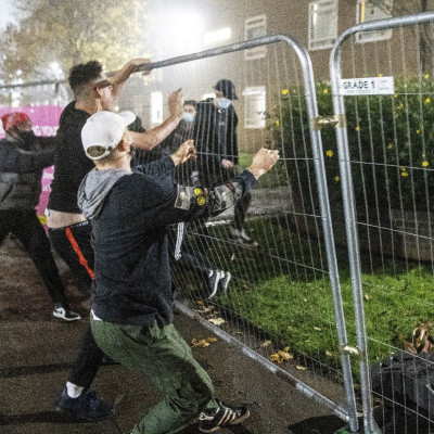 Students tear down fence