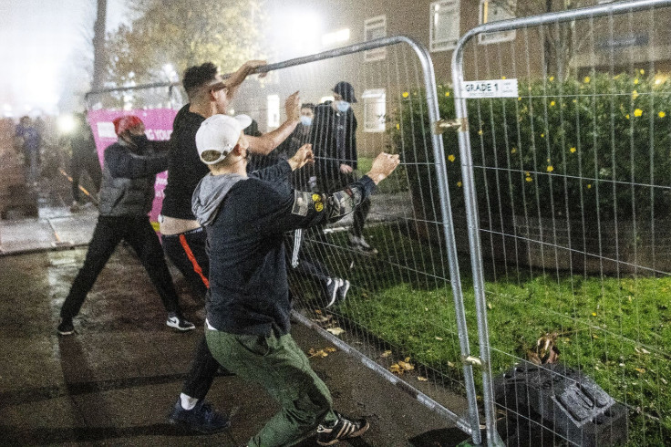 Students tear down fence