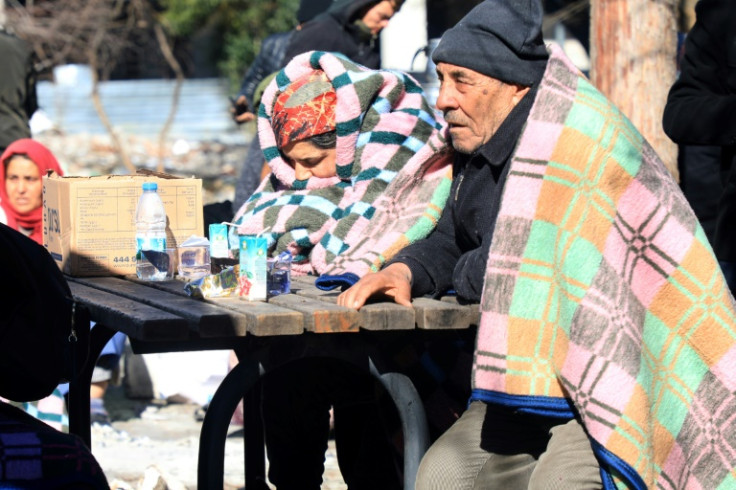 Tens of thousands in the city of two million people spent the cold night in cars or huddled around fires set up in the street