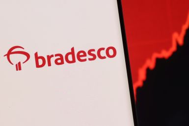 Illustration shows a smartphone with displayed Bradesco logo and stock graph