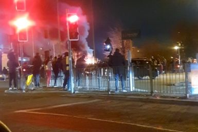 Fire outside a hotel providing refuge to asylum seekers following a protest in Knowsley