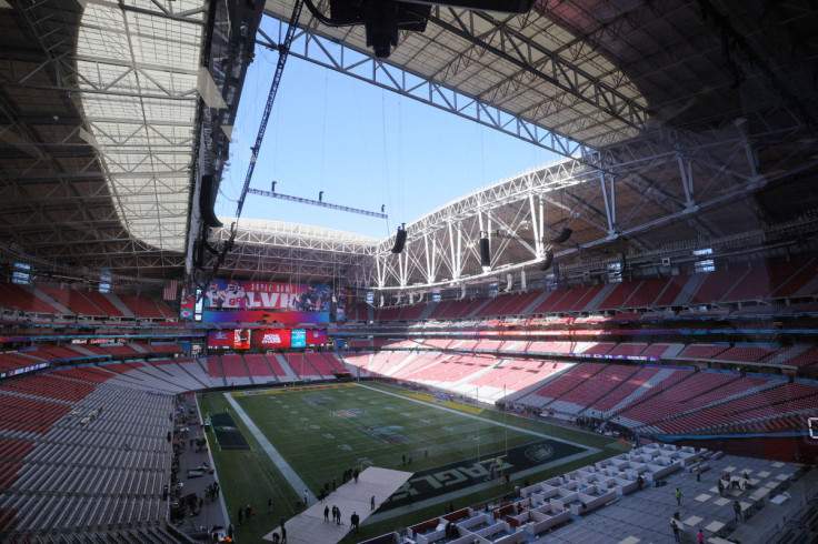 Crews prepare the field for Super Bowl LVII in Glendale
