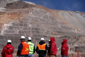 Workers stand next to an open pit at Barrick Gold Corp's Veladero gold mine in Argentina's San Juan province