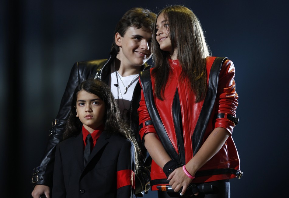 The children of late singer Michael Jackson, Prince Michael Joseph Jackson Jr. and Paris-Michael Katherine Jackson react on stage during the quotMichael Foreverquot tribute concert, which honours their father, at the Millennium Stadium in Cardiff,