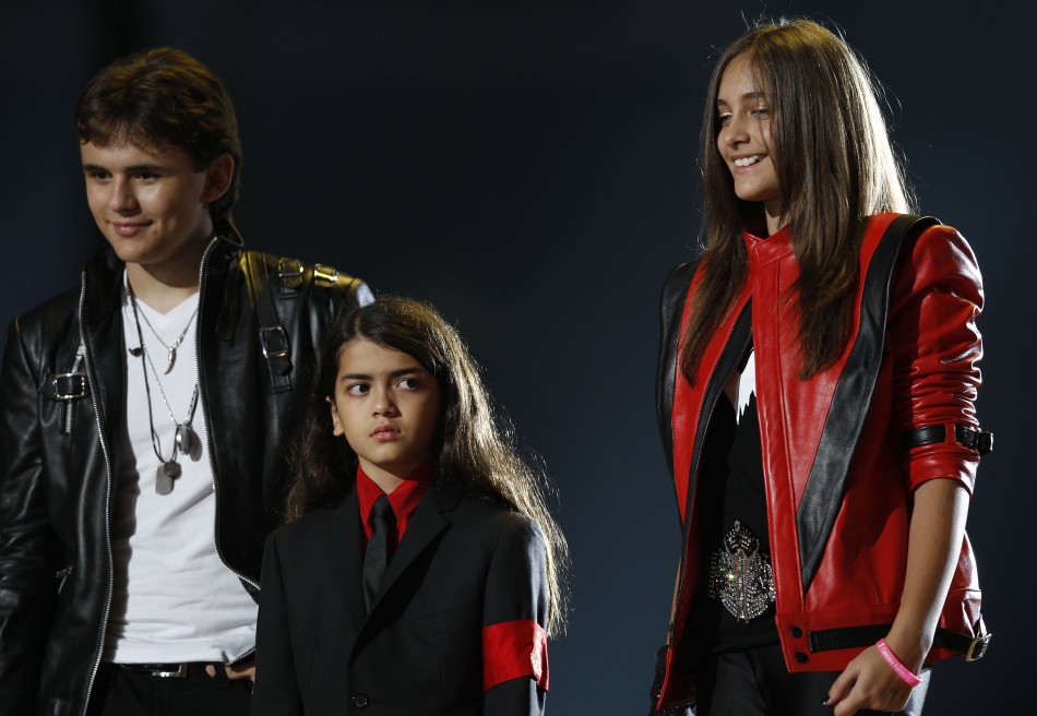 The children of late singer Michael Jackson, Prince Michael Joseph Jackson Jr. and Paris-Michael Katherine Jackson react on stage during the quotMichael Foreverquot tribute concert, which honours their father, at the Millennium Stadium in Cardiff,