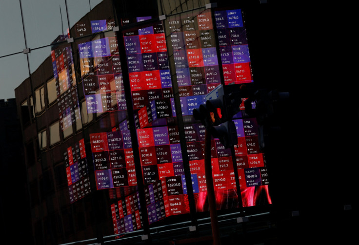 A huge electric stock quotation board is seen inside a building in Tokyo